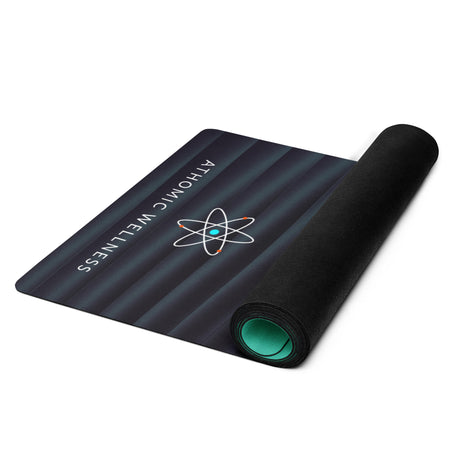 Tapis de yoga Cosmic Wave enroulé, design turquoise Athomic Wellness